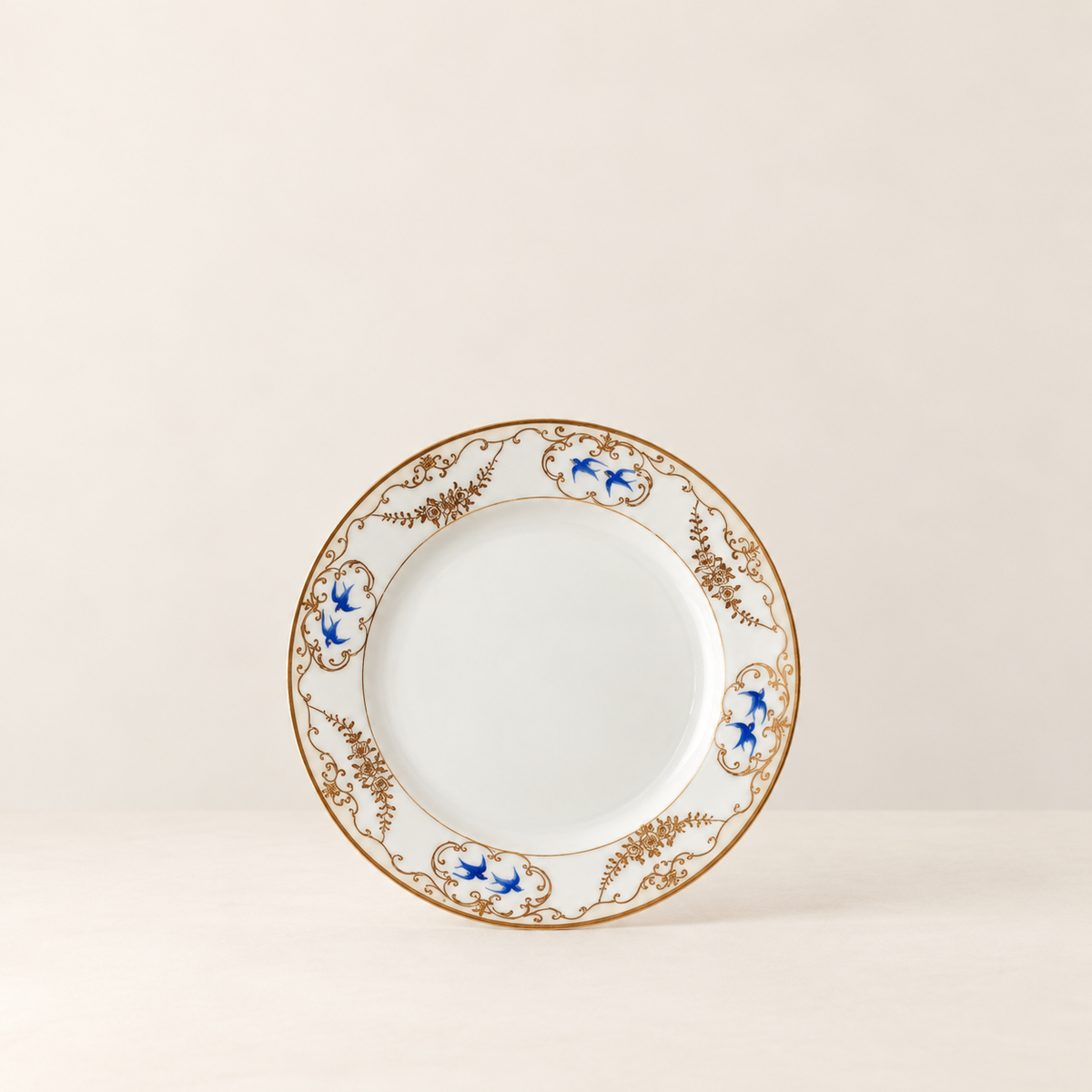 Antique Nippon blue birds in flight porcelain plate with gilded floral rim