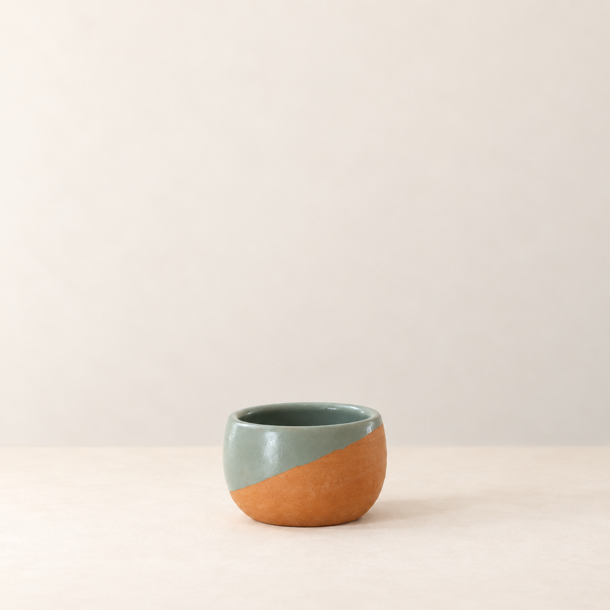 Handmade Oaxacan clay cup by Rufina Ruiz Lopez in green and terracotta