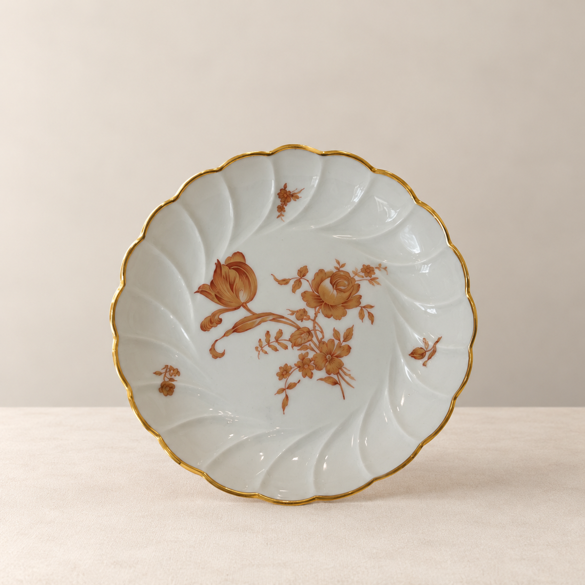 Vintage Limoges floral cake stand with gold-trimmed scalloped rim
